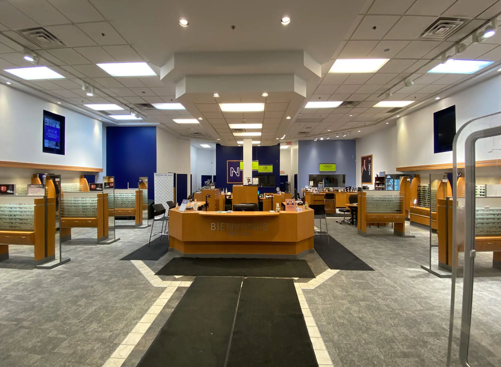 A freshly painted commercial retail interior completed by Pro Paint Plus in Montreal, QC, featuring clean finishes and modern lighting.